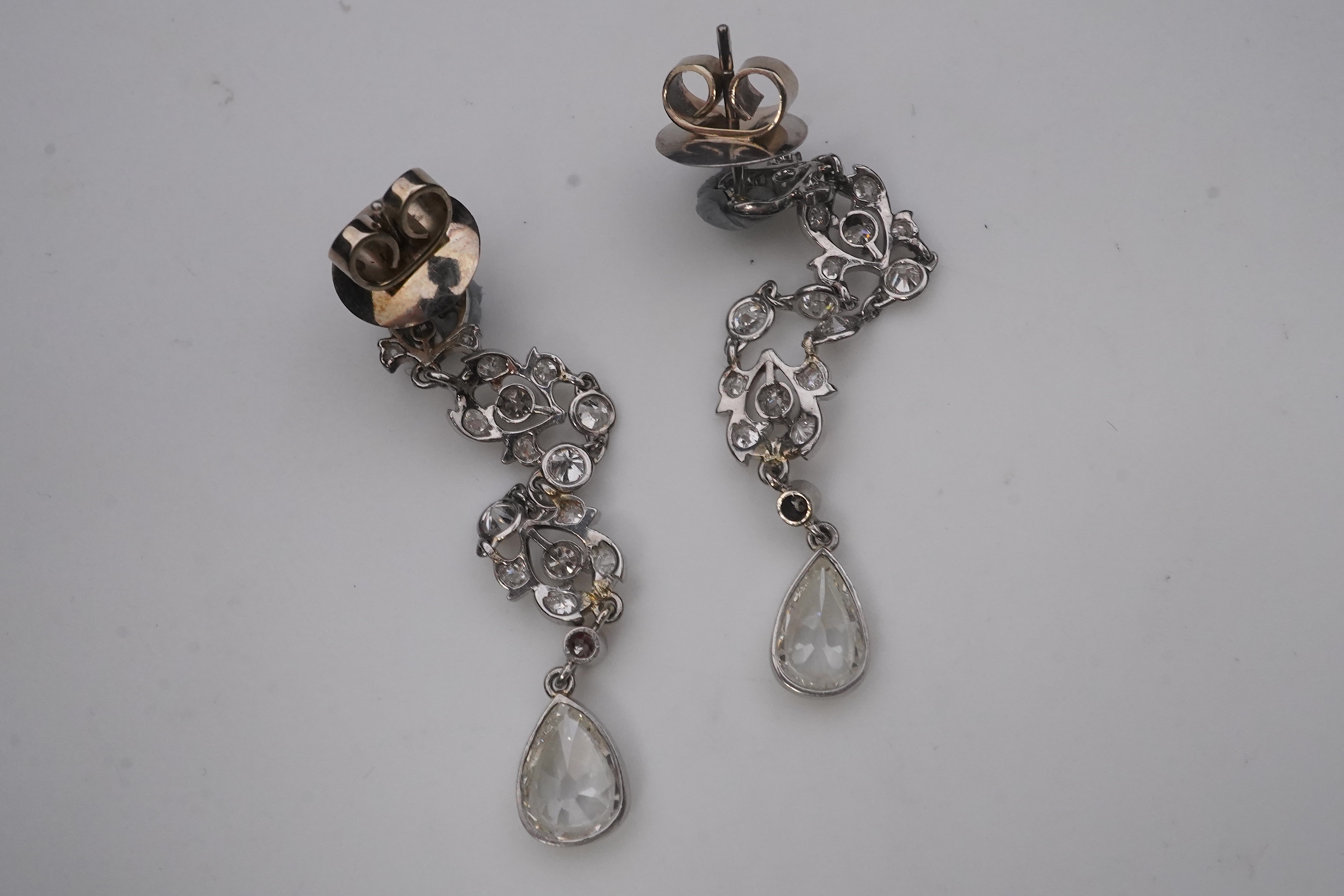 A pair of diamond earrings, early 20th century composite